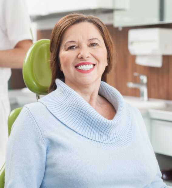 Woman smiling while visiting her Plano Texas dental office