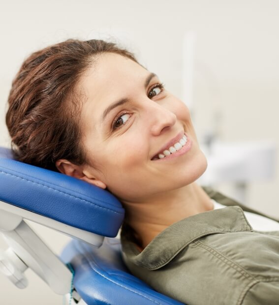 Woman sharing beautiful smile with dentist