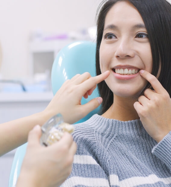 Smiling woman enjoying the benefits fo dental implants