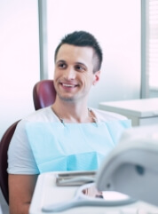 Man smiling after periodontal therapy